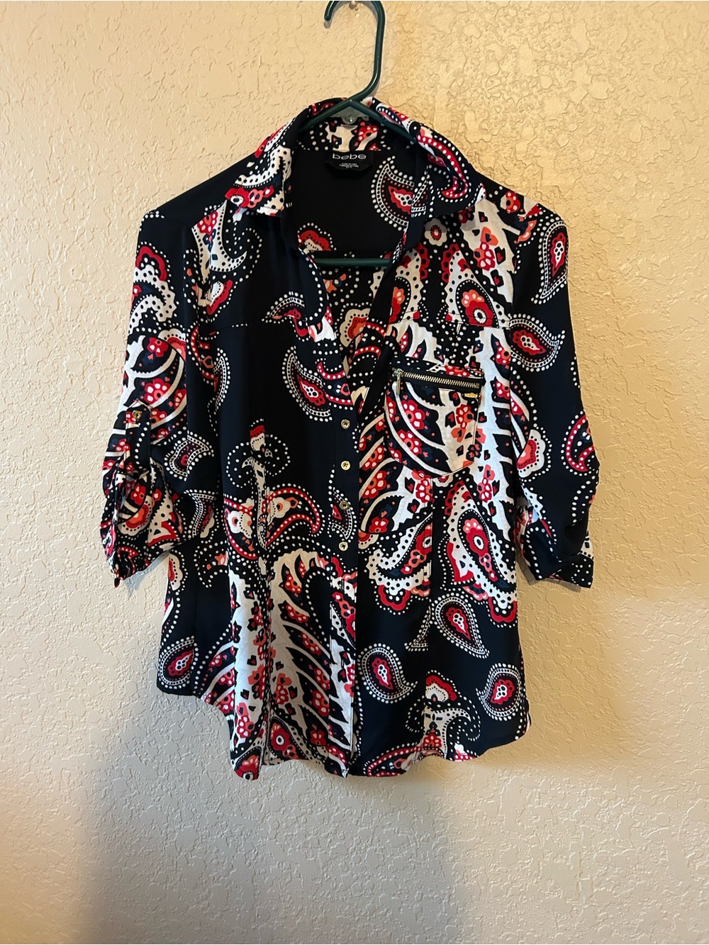 Like new soft BeBe Black Paisley Button-Front Blouse with Red & White Accents